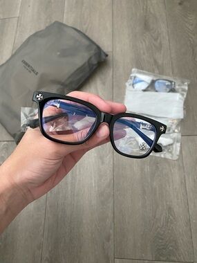 Chrome Hearts Black Frame Glasses with Blue-Tinted Lenses